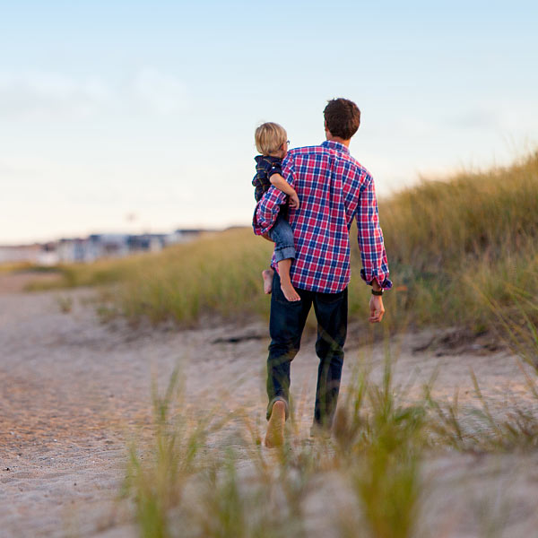 Father and Child Walking on the Beach